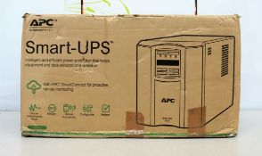 A boxed as new APC SMT1000IC 1000VA UPS (Box opened, some damage to box).
