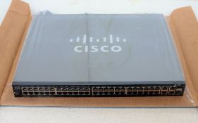 A pre-owned Cisco 52 port managed network switch (PN: SG300-52P)