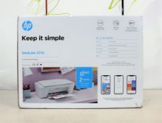 A boxed as new HP DeskJet 2710 inkjet printer/scanner in white.