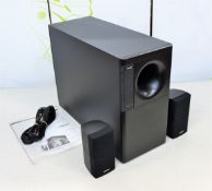 A Bose acousticmass 5 series III speaker system in black. (minor casing damage) (possibly pre-