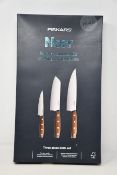 Three Fiskars Norr three piece knife sets.
