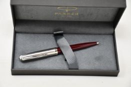 Four boxed as new Parker 51 ballpoint pens in Burgundy.