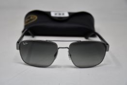 A pair of as new Ray Ban sunglasses.