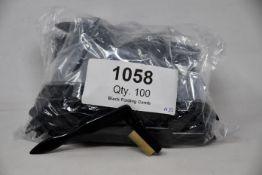 A large quantity of Tweezerman folding eyelash combs (Approximately 100 items).