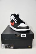 A pair of as new Nike Air Jordan 1 Mid (UK 9).