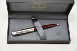 Four boxed as new Parker 51 ballpoint pens in Burgundy.
