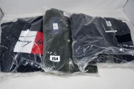 An as new Tommy Hilfiger arch artwork zip through (XXL), Tommy Hilfiger signature artwork hoodie (L)