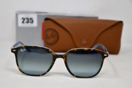 A pair of as new Ray Ban sunglasses.