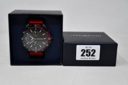 A men's as new Tommy Hilfiger Bank silicone strap black dial watch.