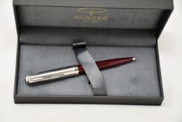 Four boxed as new Parker 51 ballpoint pens in Burgundy.