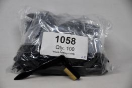 A large quantity of Tweezerman folding eyelash combs (Approximately 100 items).