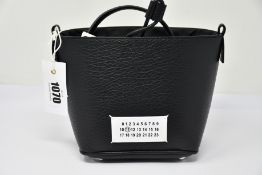 An as new Maison Margiela Numbers patch bucket bag (RRP £990).