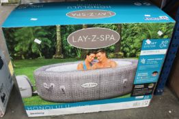 A boxed as new Bestway Lay-Z-Spa Honolulu 4-6 person hot tub.