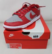 A pair of as new Nike Dunk Low Retro (UK 8.5).