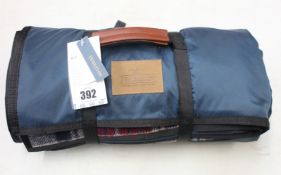 A Pendleton nylon backed roll up blanket.