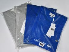 Two as new Lacoste T-shirts (US 3XL) and two Lacoste sweaters (US M, L).