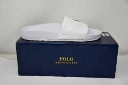 Four pairs of as new Ralph Lauren Cayson sliders (1 x UK 7, 1 x UK 9, 2 x UK 10).