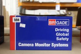 A boxed Brigade VBV-750-000 camera monitor system.