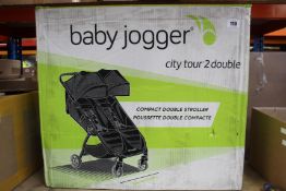 An as new Baby Jogger City Tour 2 Double Compact Stroller.