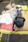 A large quantity of weights, kettle bells and related items.