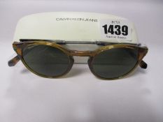 A pair of as new Calvin Klein Jeans sunglasses.