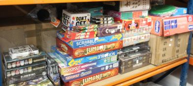 A quantity of miscellaneous toys, board games and related items to include an HTI Junior Urban Pram,
