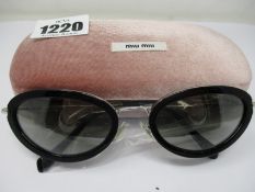 A pair of as new Miu Miu sunglasses.