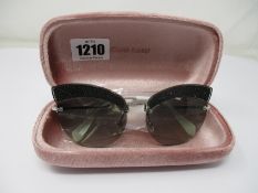 A pair of as new Miu Miu sunglasses.