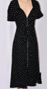 An as new Prada Occasion dress in black with white spots (IT 42).