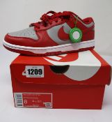 A pair of as new Nike Dunk Low Retro (UK 7).