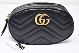 An as new Gucci Beltbag in black with dust bag (RRP £865).