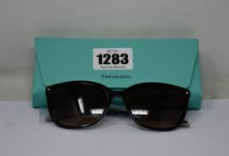 A pair of as new Tiffany & Co sunglasses.