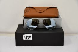 A pair of as new Ray Ban sunglasses.