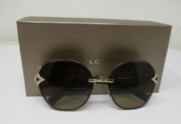 A pair of as new Bvlgari sunglasses.