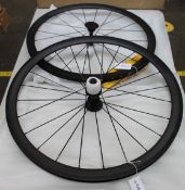 A pair of as new 38mm deep carbon fibre bicycle wheels, 20 hole front, 24 hole rear, Aero spokes,