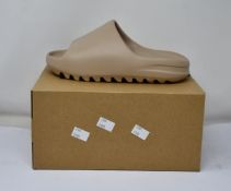 A pair of as new Adidas Yeezy Slide (UK 6).