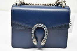 An as new Gucci Dionysus small handbag in navy with dust bag (RRP £1,600).