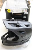 A Fox Rampage large bike helmet in black (Some damage to box).