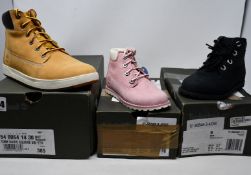 A pair of youths as new Timberland Davis Square 6 Inch boots (UK 5) and two pairs of toddlers