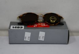 A pair of as new Ray Ban Round sunglasses.