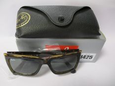 A pair of as new Ray Ban Inverness sunglasses.