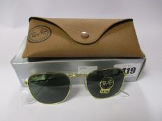 A pair of as new Ray Ban Frank sunglasses.