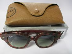 A pair of as new Ray Ban Roundabout sunglasses.