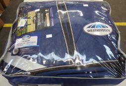 A Weatherbeeta ComfiTec ultra tough detach-a-neck heavy equestrian turnout rug.