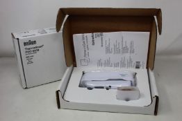 A boxed as new Welch Allyn Braun ThermoScan PRO 6000 ear thermometer with cradle.
