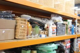 A shelf of household and related items to include a Philips juicer, glassware and picture frames.