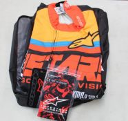 An as new Alpinestars KMX-9 V2 graphic suit in Black/Orange/Red (Size: EUR 60).