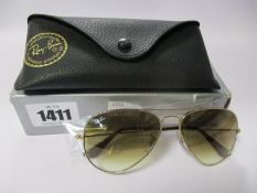 A pair of as new Ray Ban Aviator large metal sunglasses.
