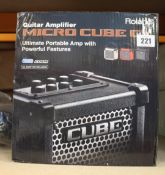 A Roland Micro Cube GX - Portable Guitar Amp (UK adaptor required).