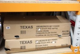 Two boxed as new Texas cattle brushes with springs.